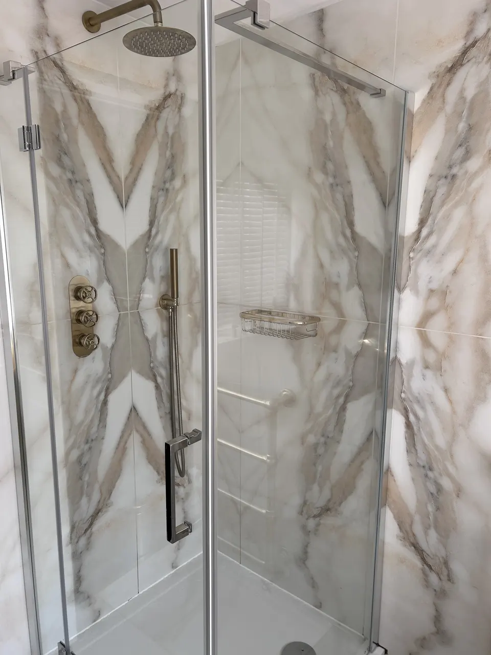 Marble walk-in shower enclosure