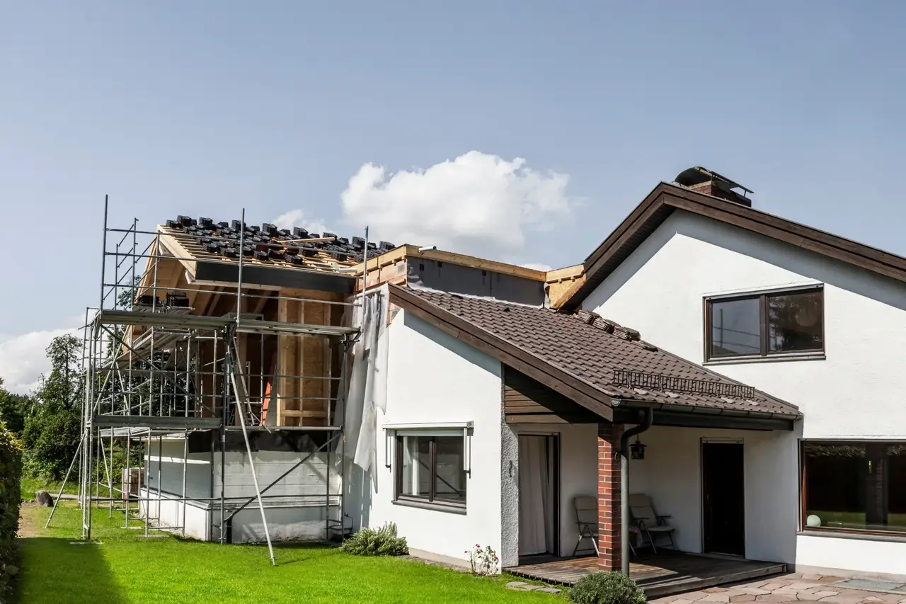 House extension in progress with scaffolding in Great Dunmow by Claremont Build & Co